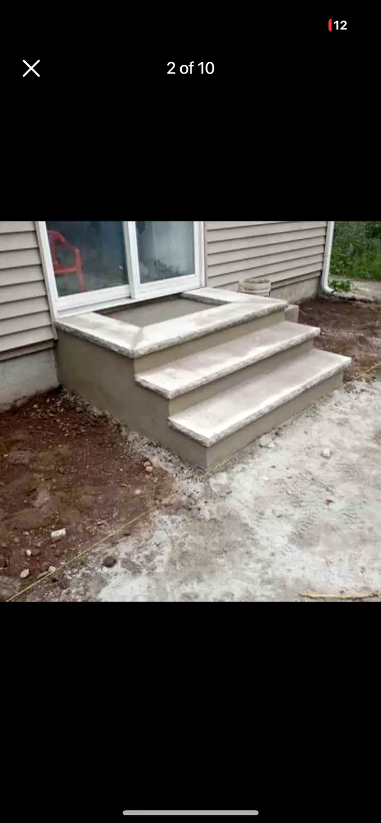 New concrete front steps with bullnose treads at a side entry.